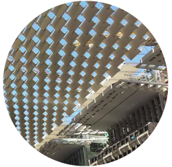 round button Kinetic Structures with metal sunshade over a plaza